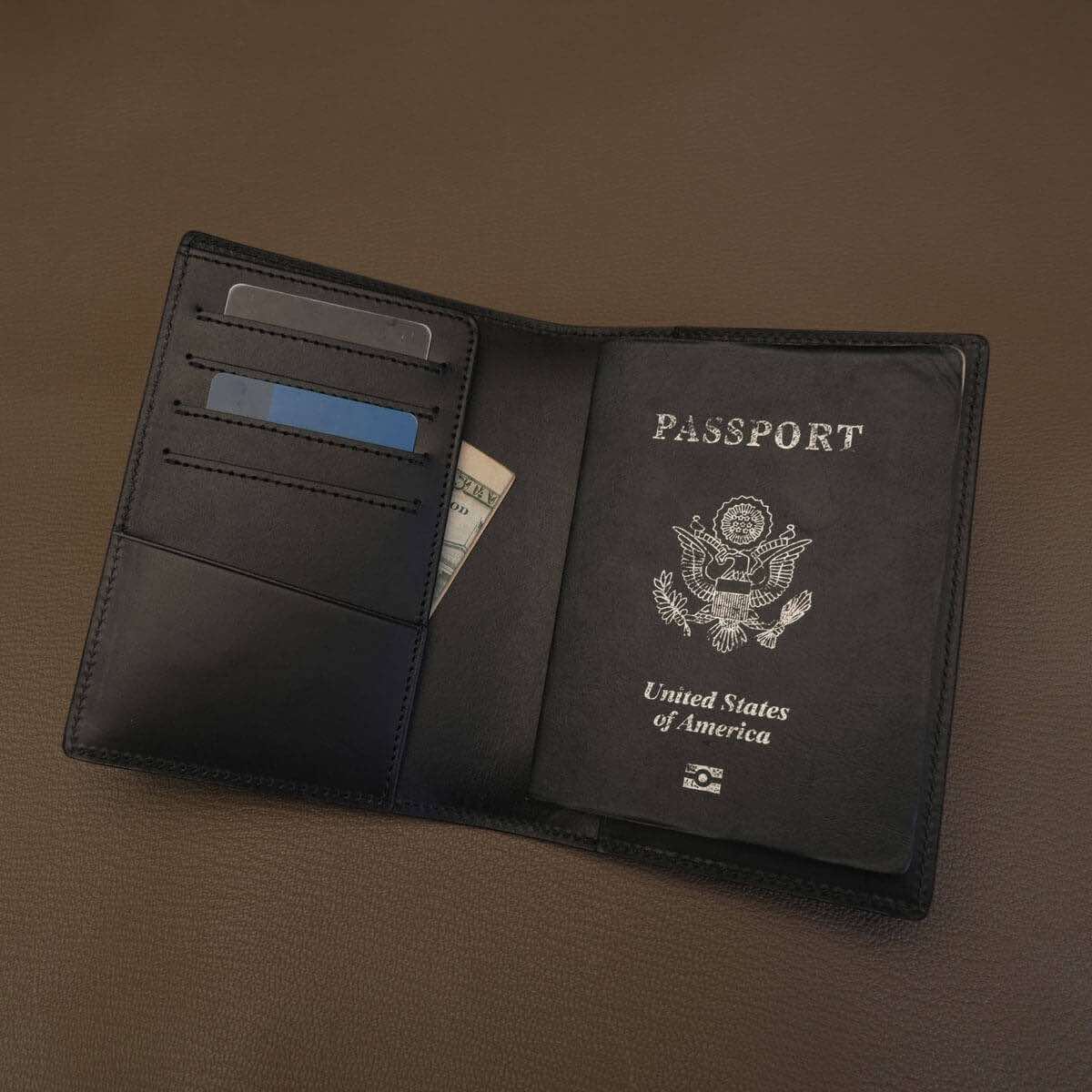 Unbranded black Buttero leather RFID passport case interior view for wholesale and custom logo private label.