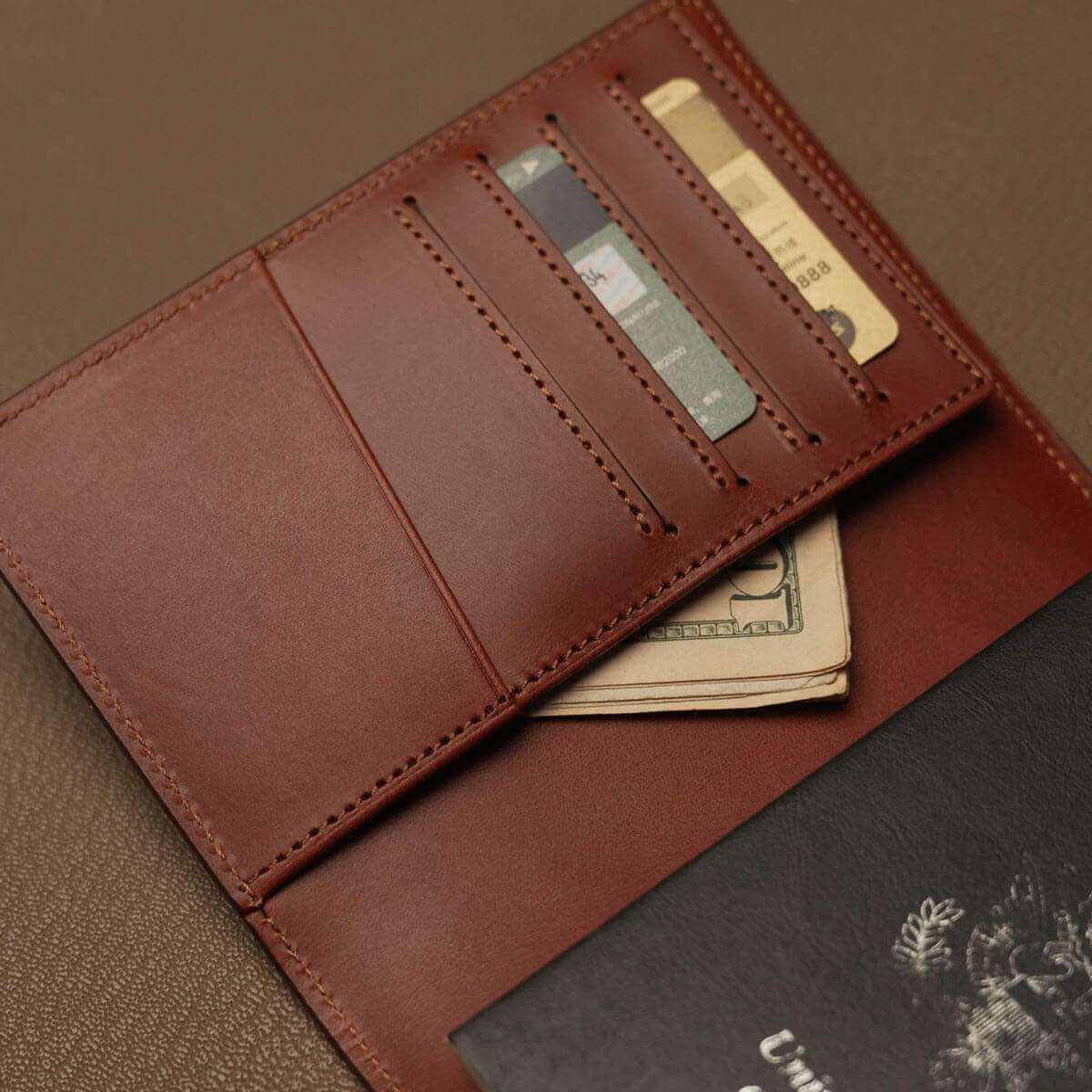 Close-up of 4 vertical card slots and slanted receipt pocket on genuine leather passport wallet, custom OEM production.
