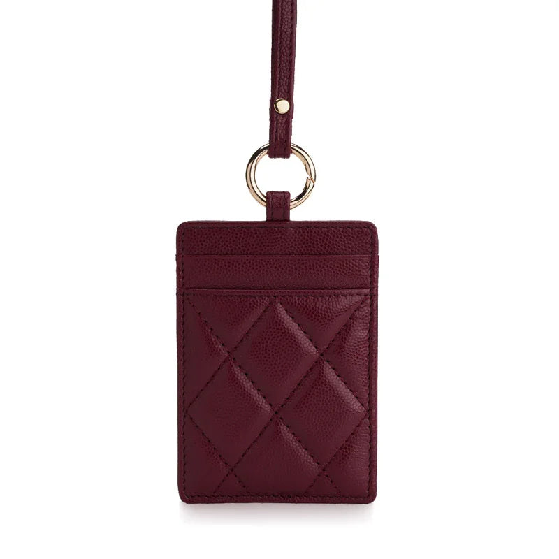 Burgundy quilted leather ID card holder with gold ring and strap, luxury accessory
