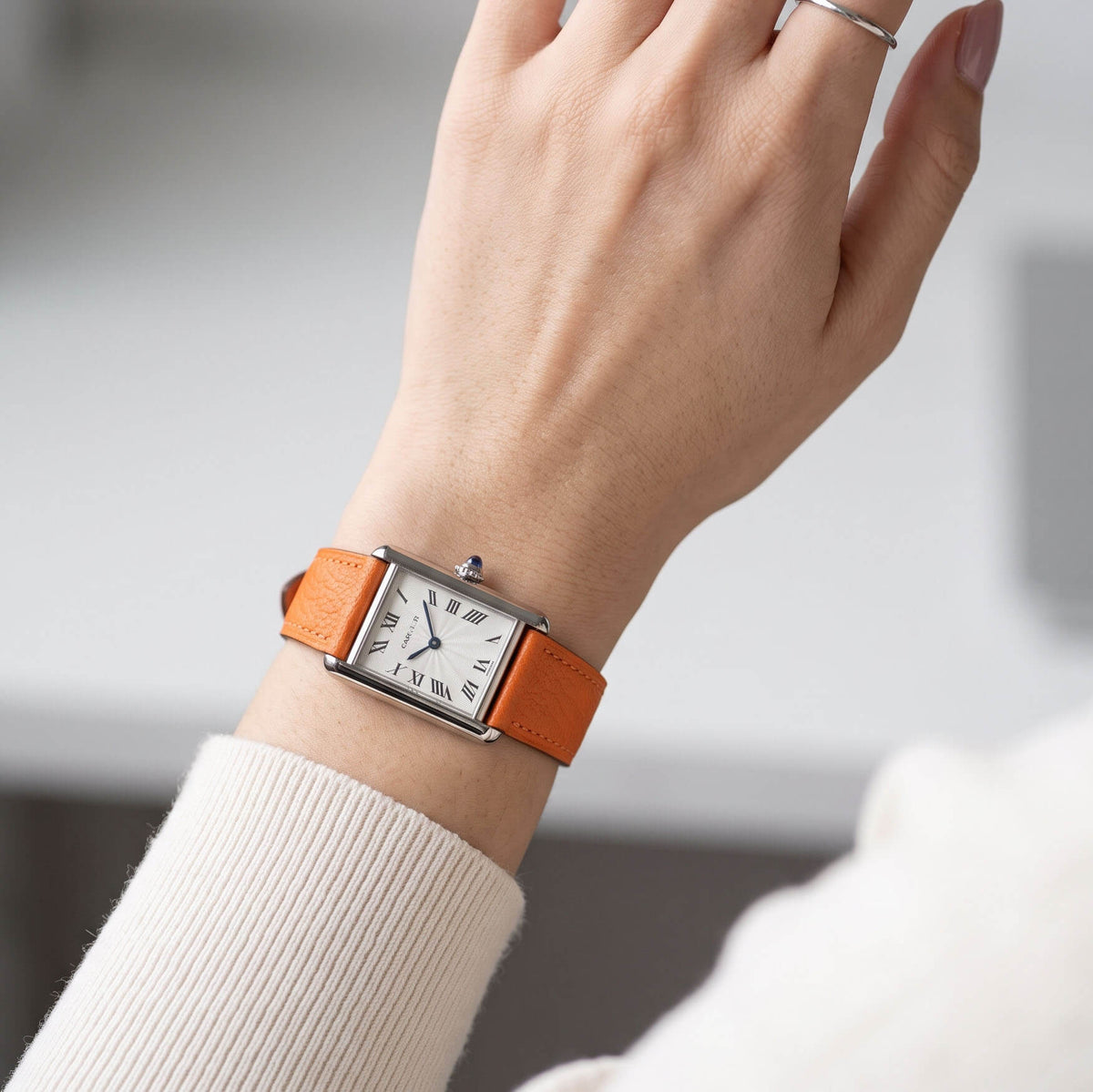 Slim 1.8mm orange Alran chèvre leather watch band fitted on classic tank watch on wrist