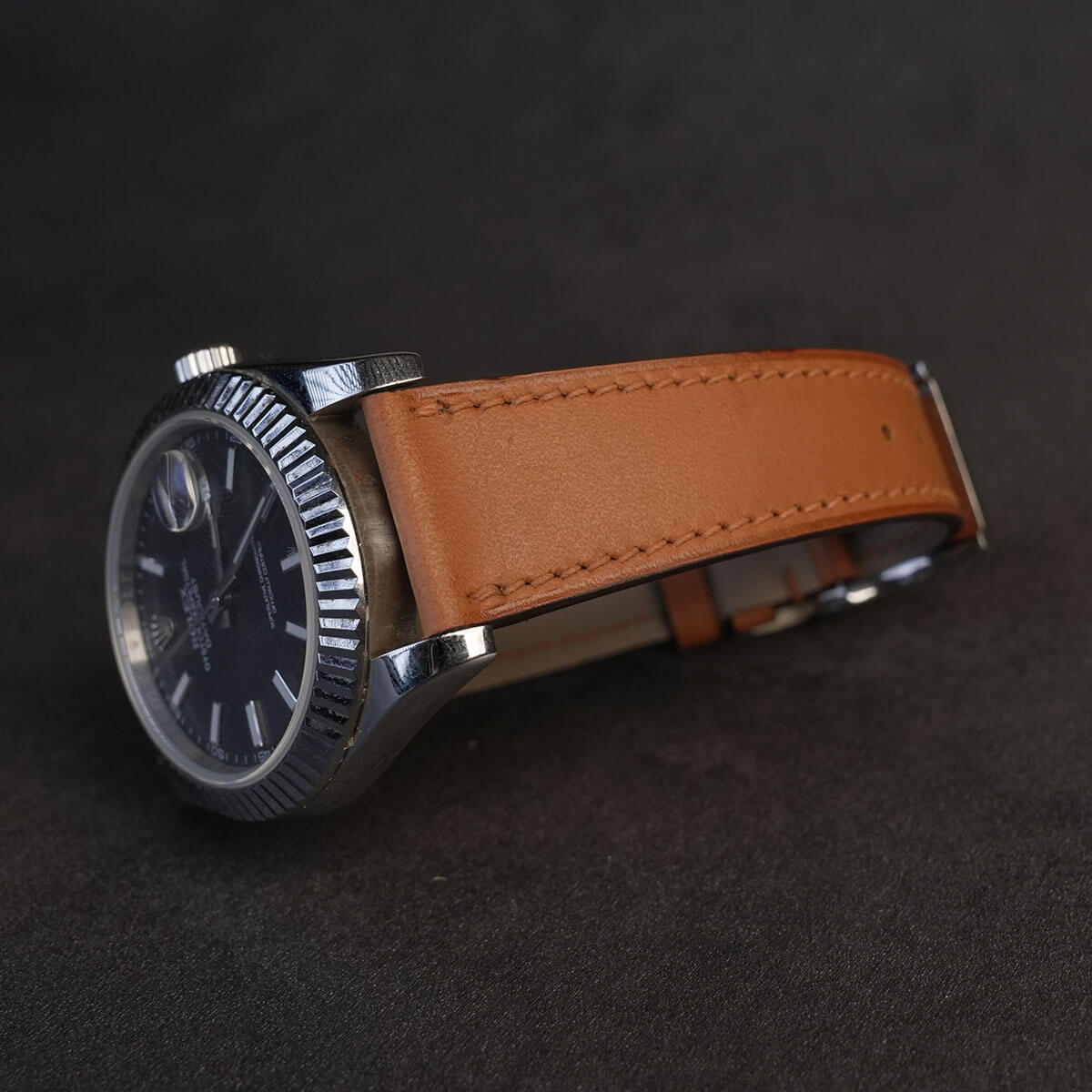 Side profile view of 1.8mm flat Italian calf leather watch strap highlighting sealed edge paint and lug fitting