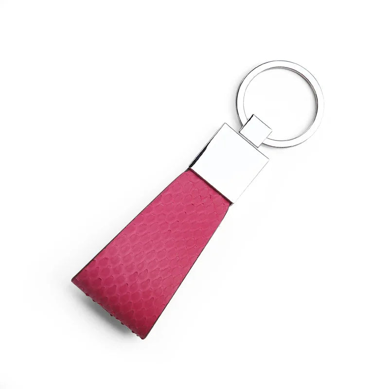 rose python skin keychain with a silver ring on a white background