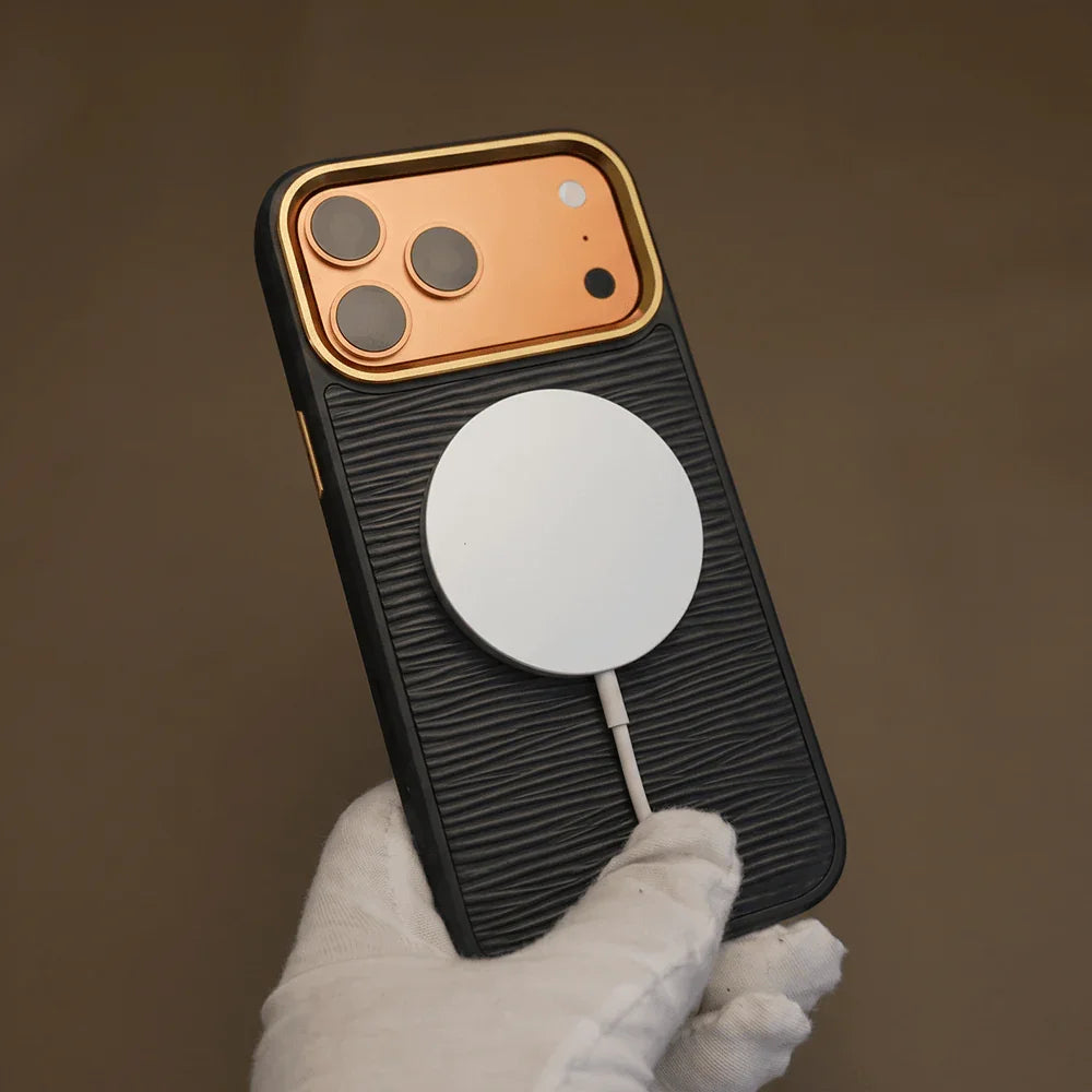 Phone case with a magsafe charging pad held by a gloved hand against a brown background