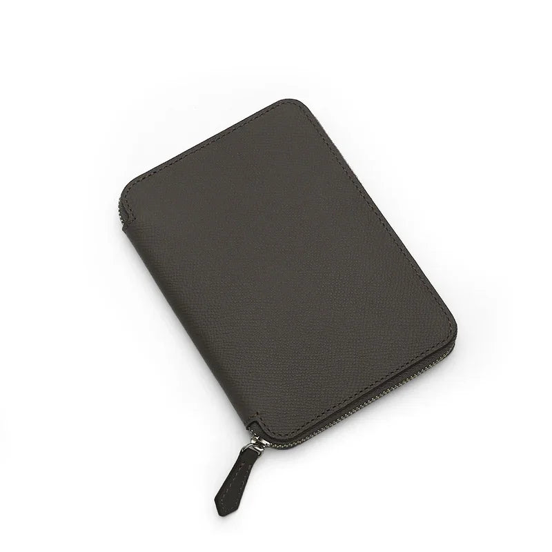 Grey Epsom leather passport wallet on a white background