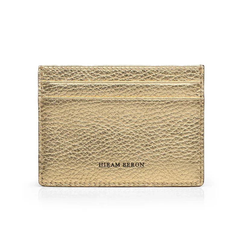Trim gold pebble leather cardholder with 'Hiram Beron' branding on a white background