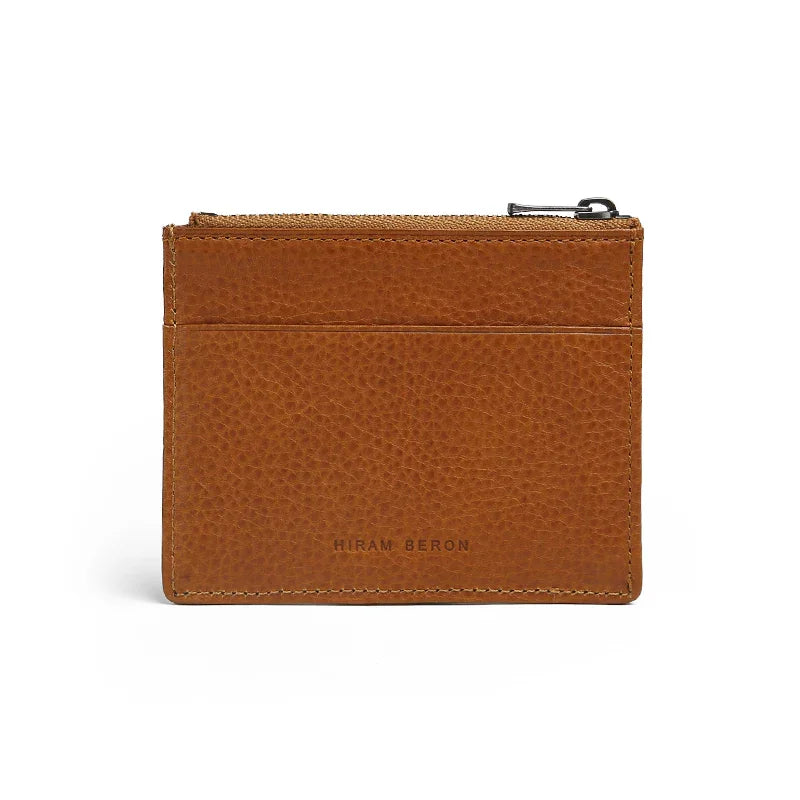 Brown leather wallet with brand name"HIRAM BERON" on a white background