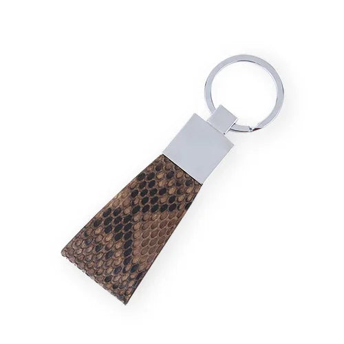silver Keychain with genuine snake skin on a white background