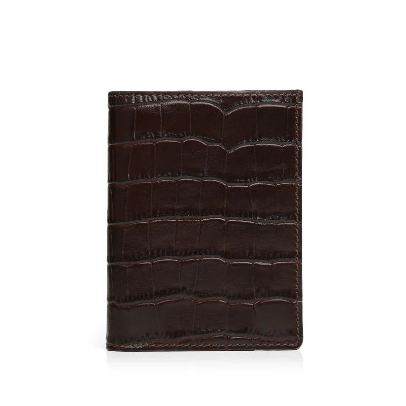 Brown aligator-patterned leather wallet on a white background