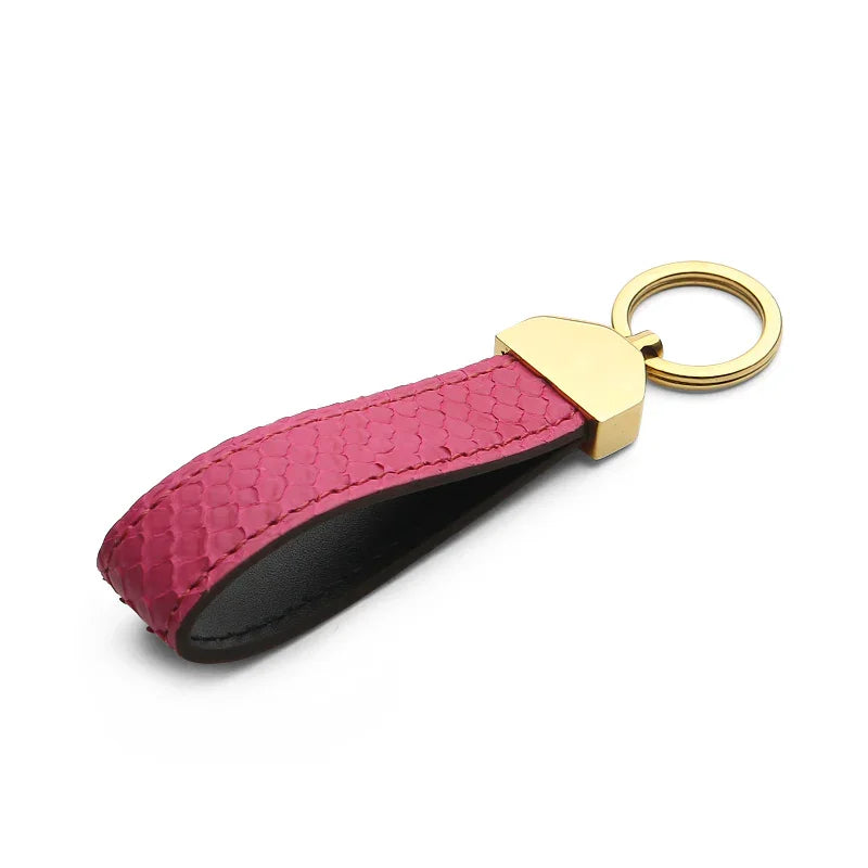 rose python skin keychain with gold clasp on a white background
