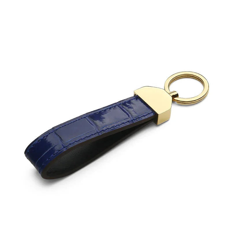 Detail of hand-painted edges on a handcrafted leather key FOB.