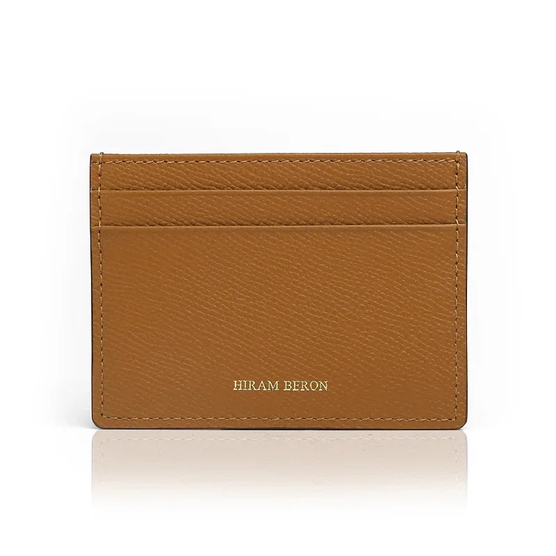 Light Brown leather cardholder with 'Hiram Beron' branding on a white background