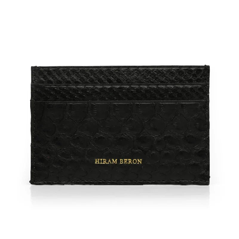 Black genuine python skin cardholder with 'Hiram Beron' branding on a white background