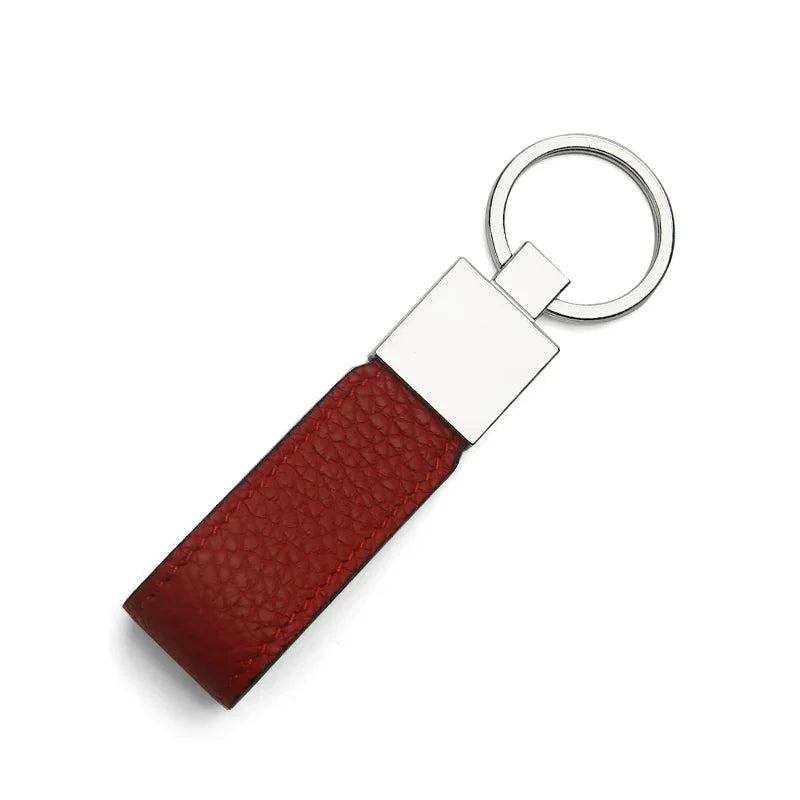 Red leather key fob with a silver ring on a white background