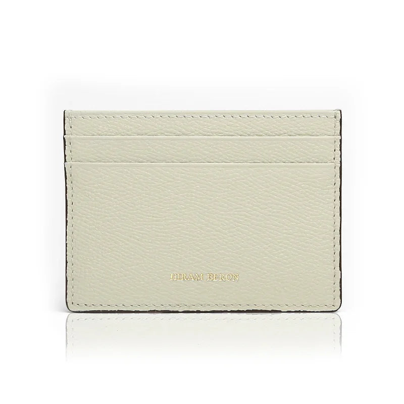 white cardholder with 'Hiram Beron' brand on a white background
