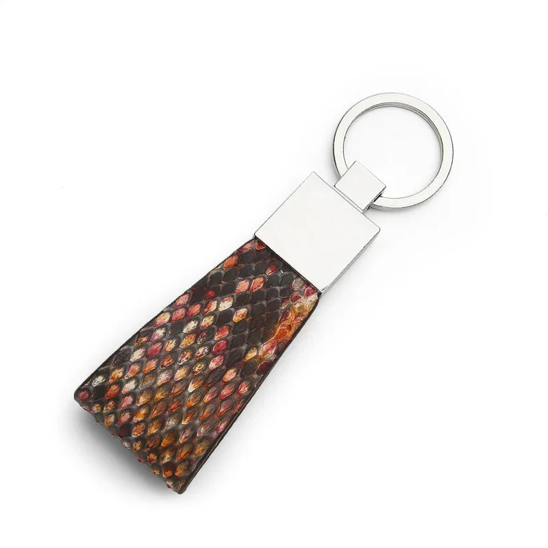 Keychain with snake skin on a white background
