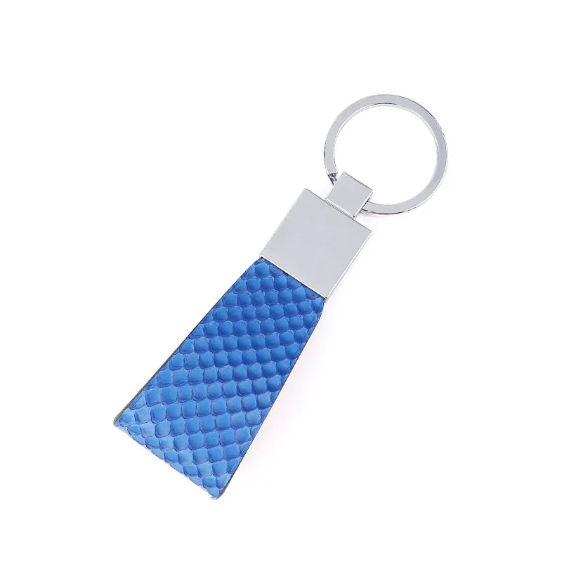 Blue python skin keychain with silver metal tag on a white background