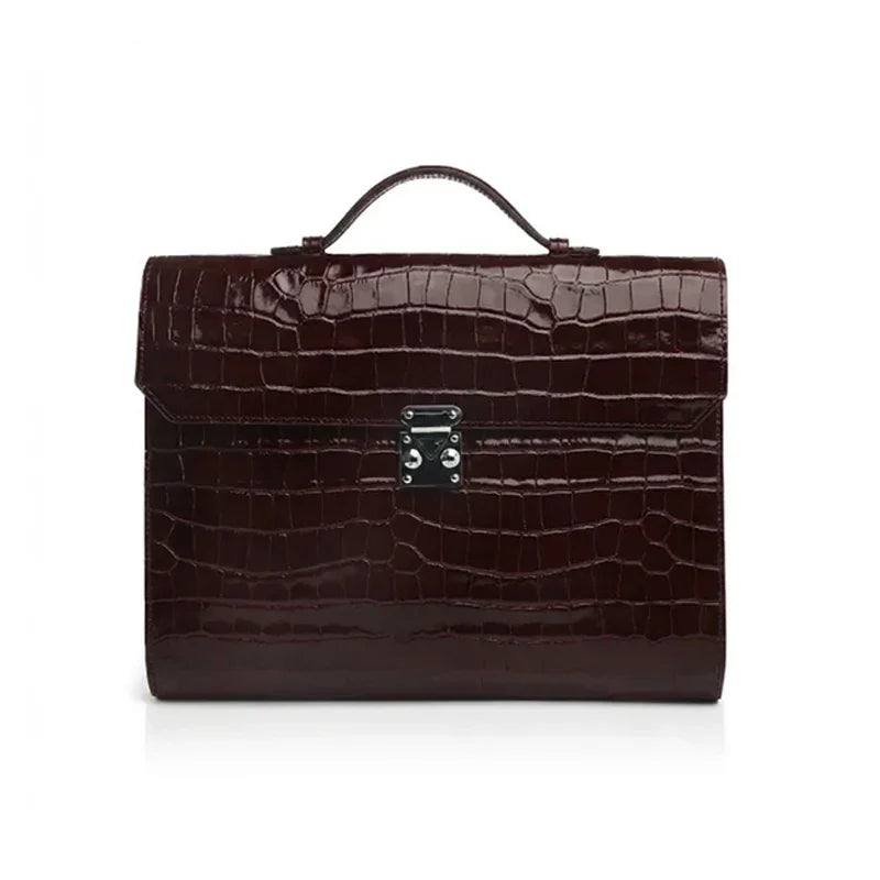 Burgundy crocodile-patterned leather business folios on a white background