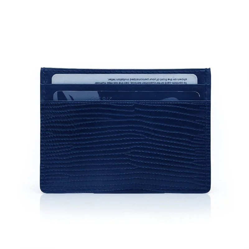 Navy blue lizard pattern leather cardholder on a white background