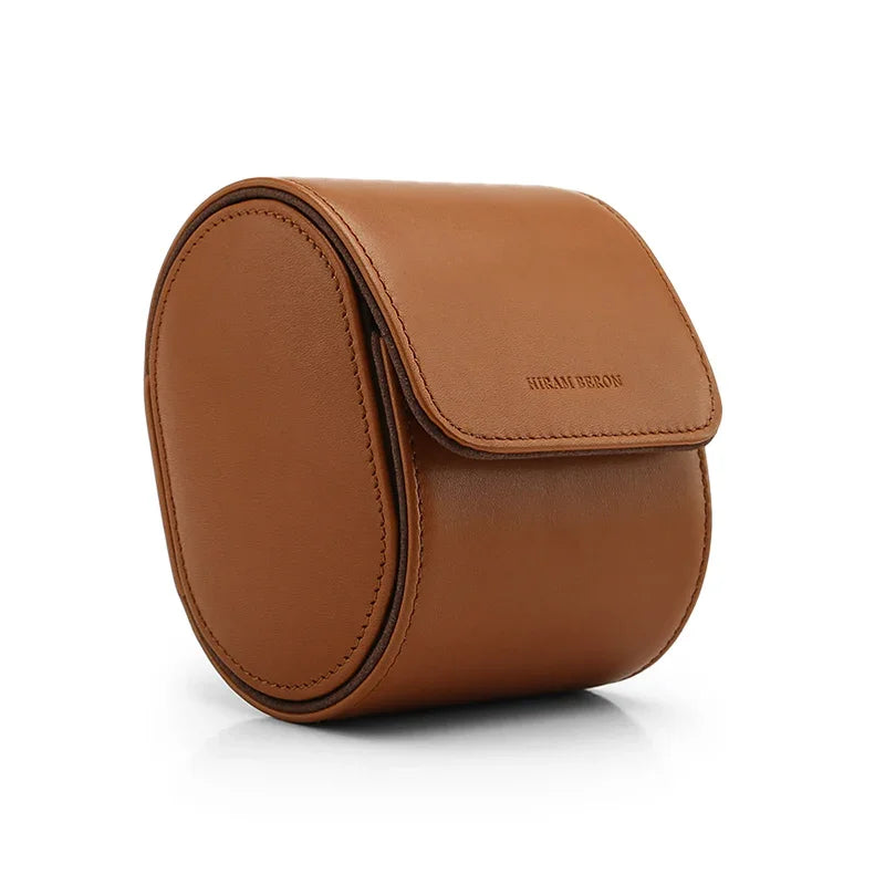 Brown leather watch roll case on a white background