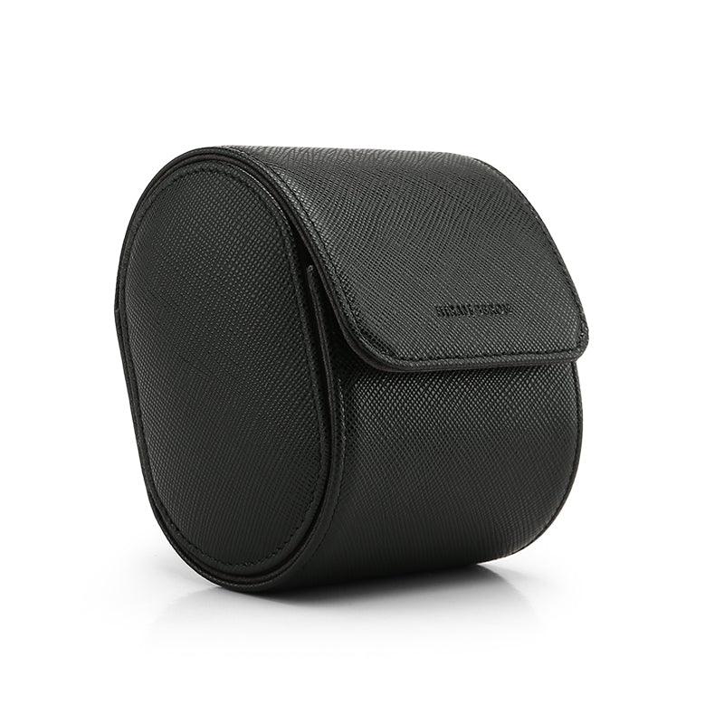 Black leather round watch roll case on a white background