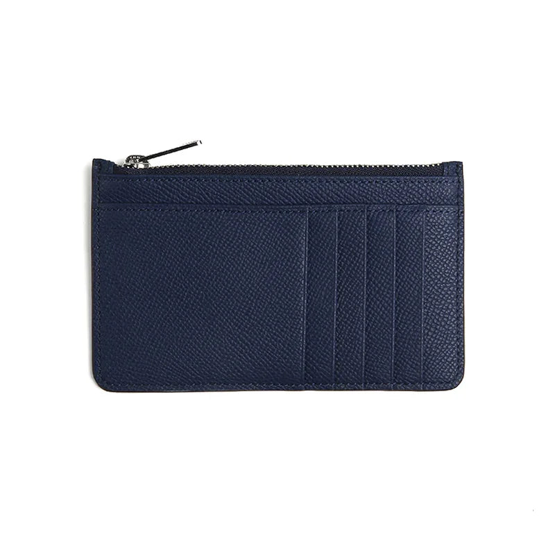 Navy blue leather wallet with a zipper on a white background