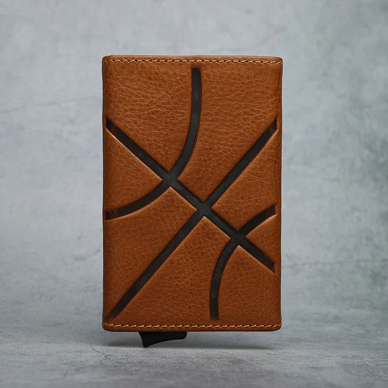 Brown leather RFID blocking POP UP CARD HOLDER with baskestball embossing line on a gray background