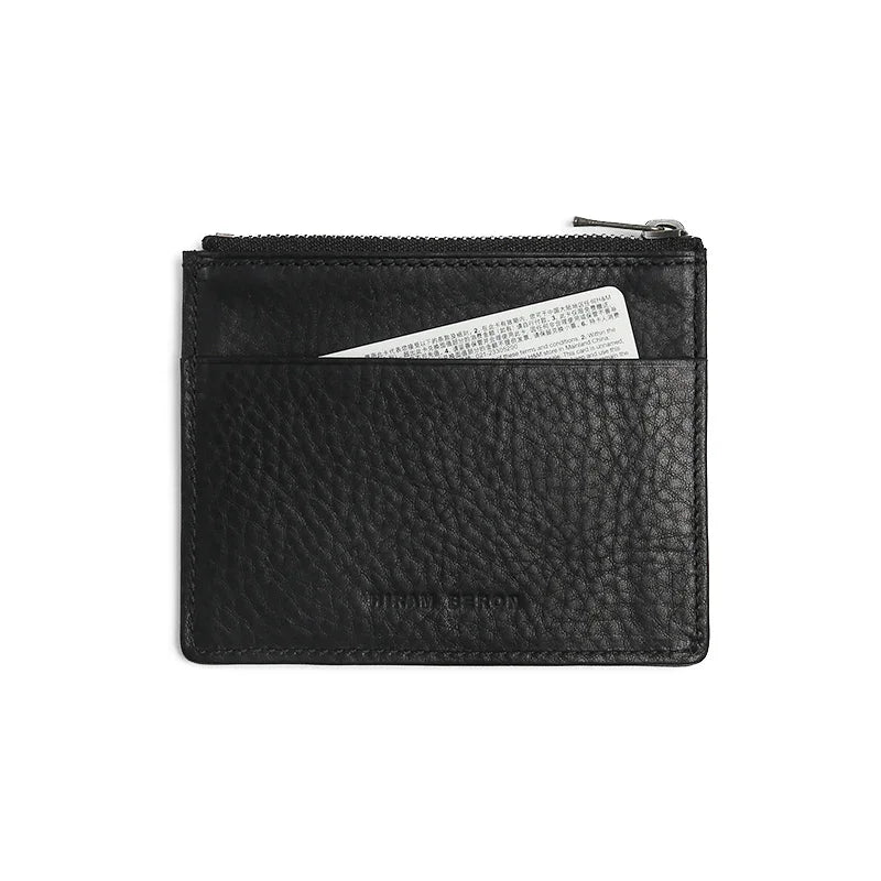 Black leather zipper card case with a card inside on a white background