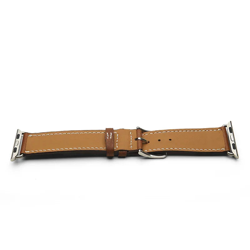 Brown leather watch strap with silver metal clasp on a white background