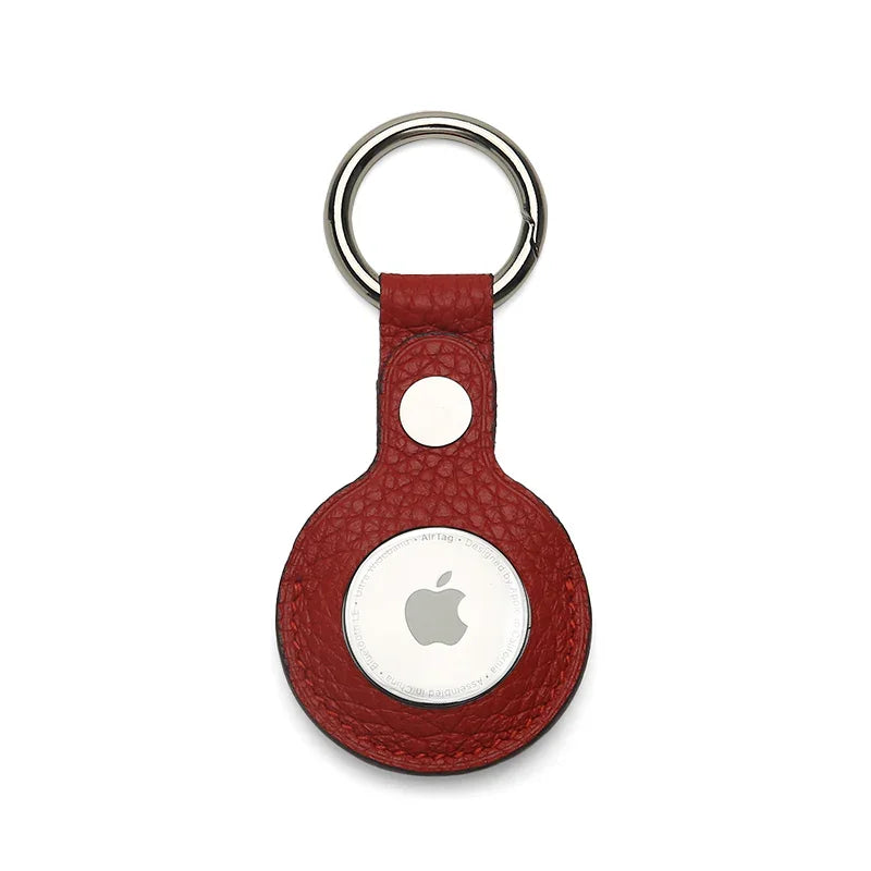 Red pebble leather airtage keychain on a white background