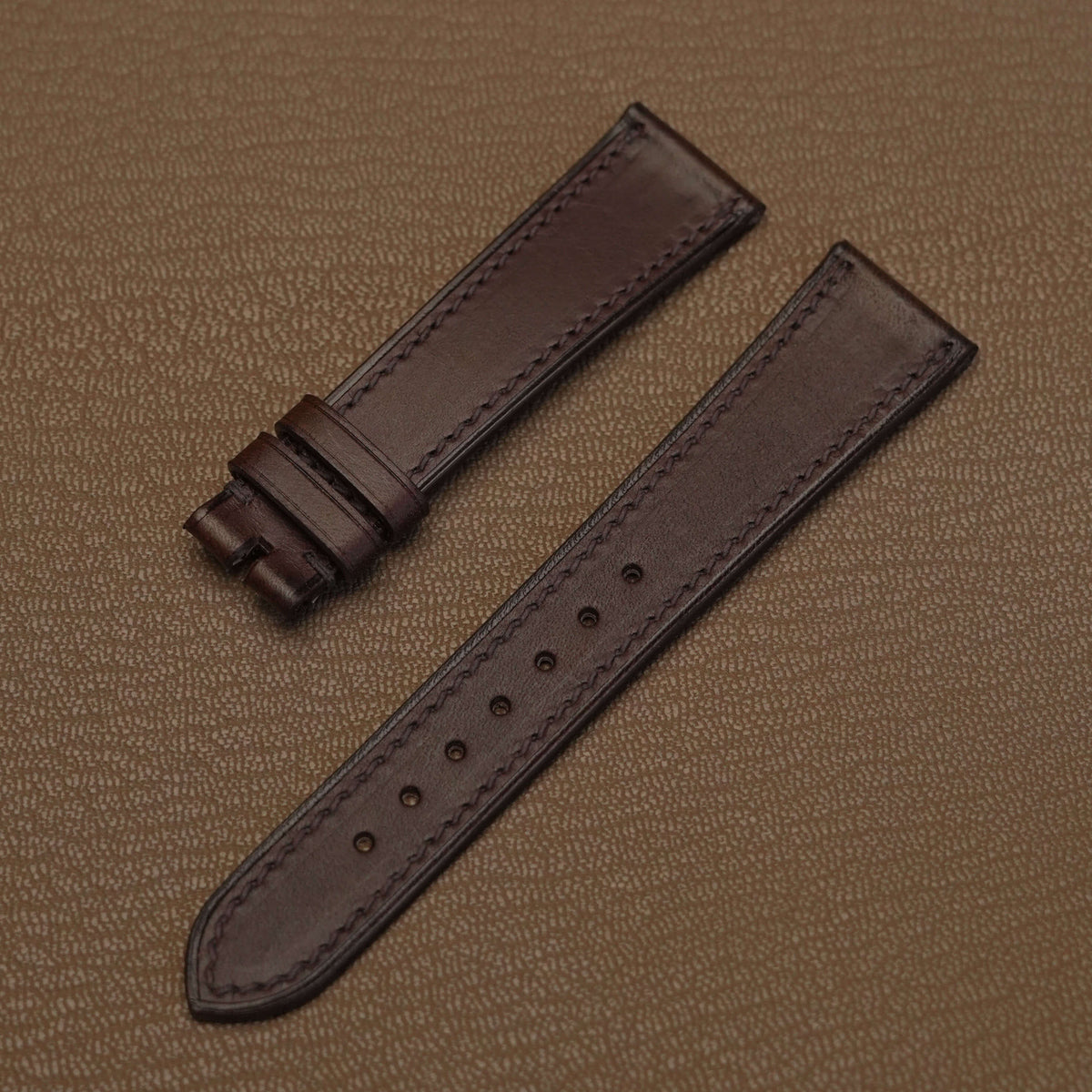 Pair of 1.8mm flat dark brown Badalassi Minerva Liscio veg-tan watch bands showing smooth grain texture