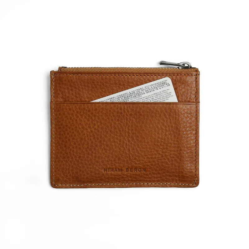 Brown Italian leather zipper card case with a card slot on a white background
