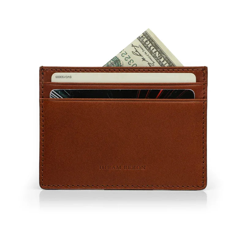 Brown Italian leather wallet with cards and money on a white background