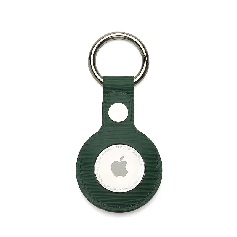 Green textured leather AirTag keychain with metal ring, sleek Apple tracker accessory