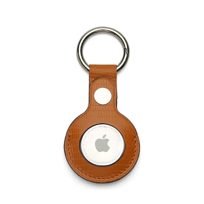 Orange leather Apple AirTag holder on a white background