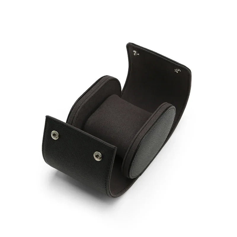 Handcrafted opened leather travel watch case with internal suede pillow and silver snaps.