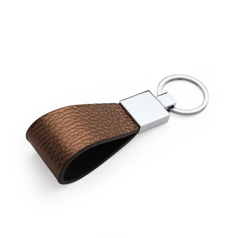Detail of hand-painted edges on a handcrafted leather key FOB