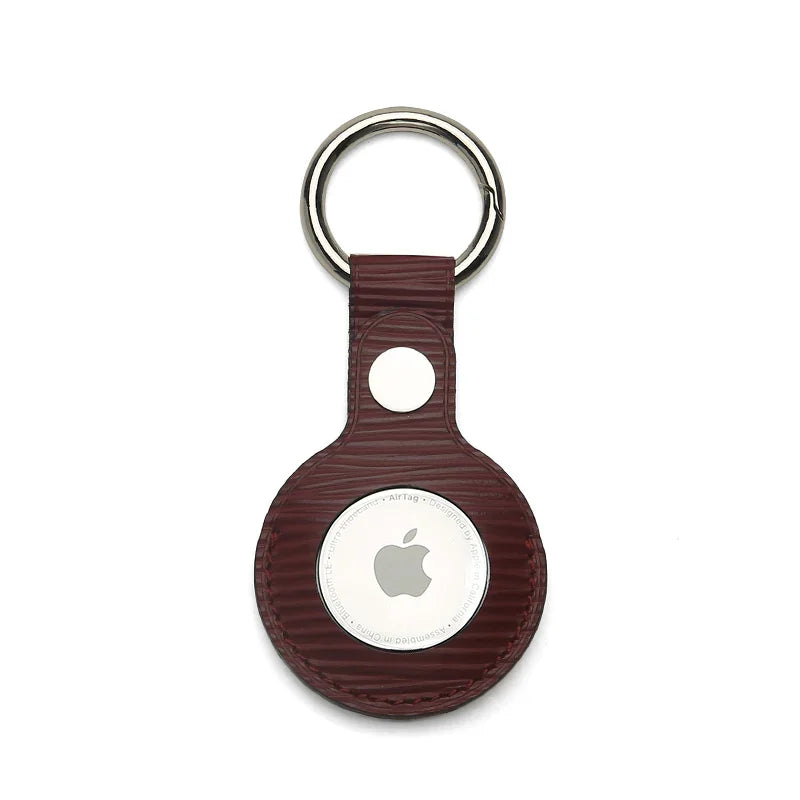 Luxury burgundy leather AirTag keychain with silver ring, premium accessory for Apple AirTag
