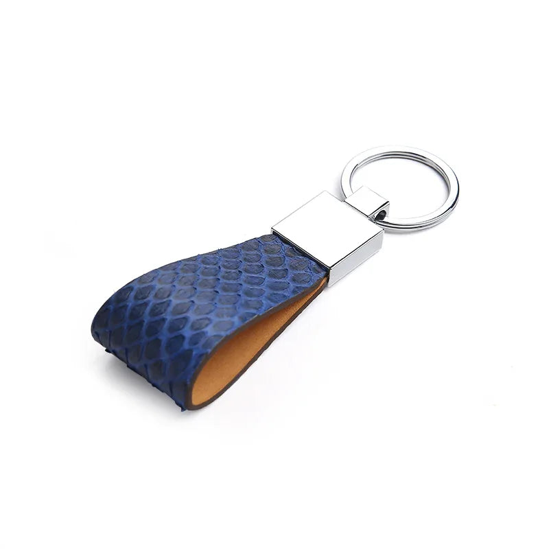 Blue snake skin keychain on a white background