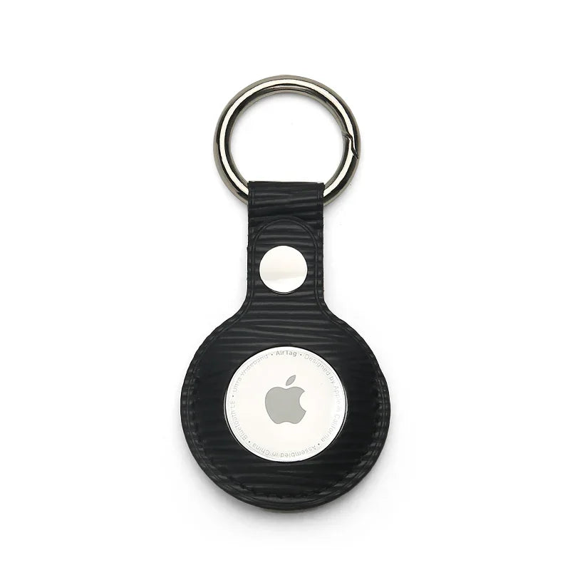 Black textured leather AirTag keychain with metal ring, sleek Apple tracker accessory for keys