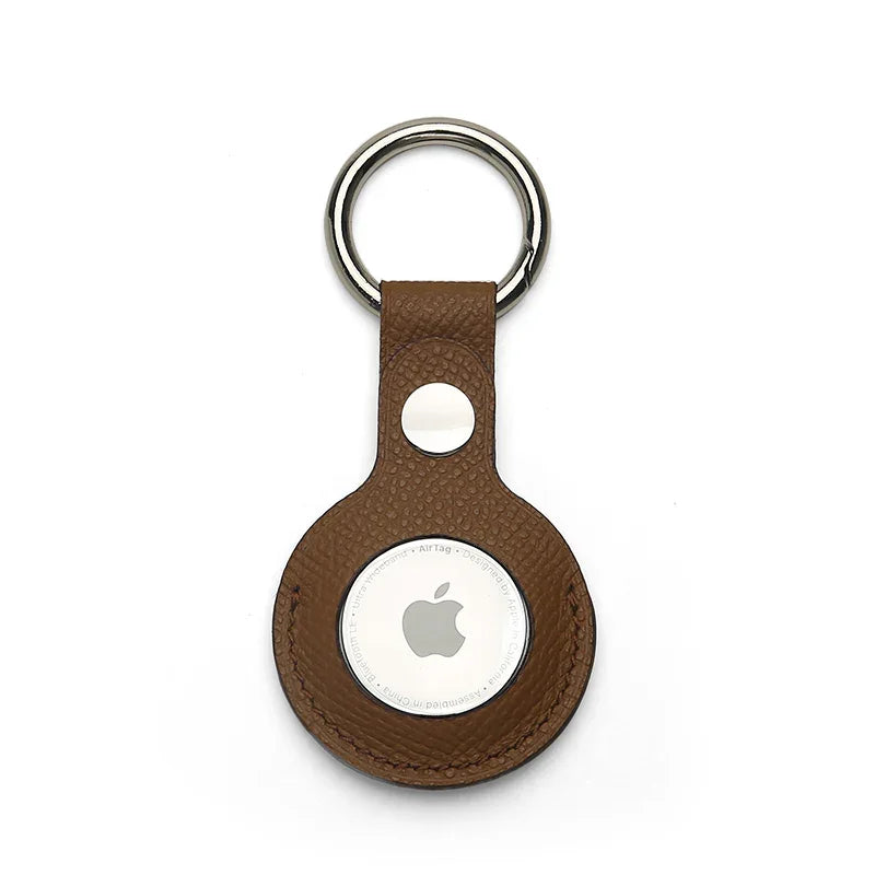 Brown leather airtag holder on a white background