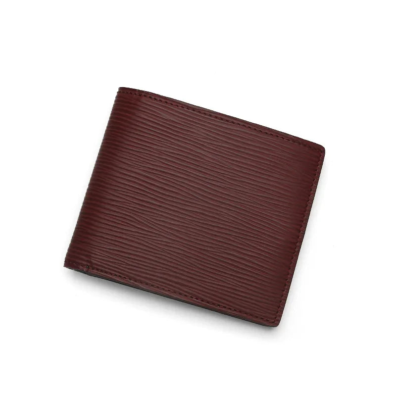 Burgundy leather wallet on a white background
