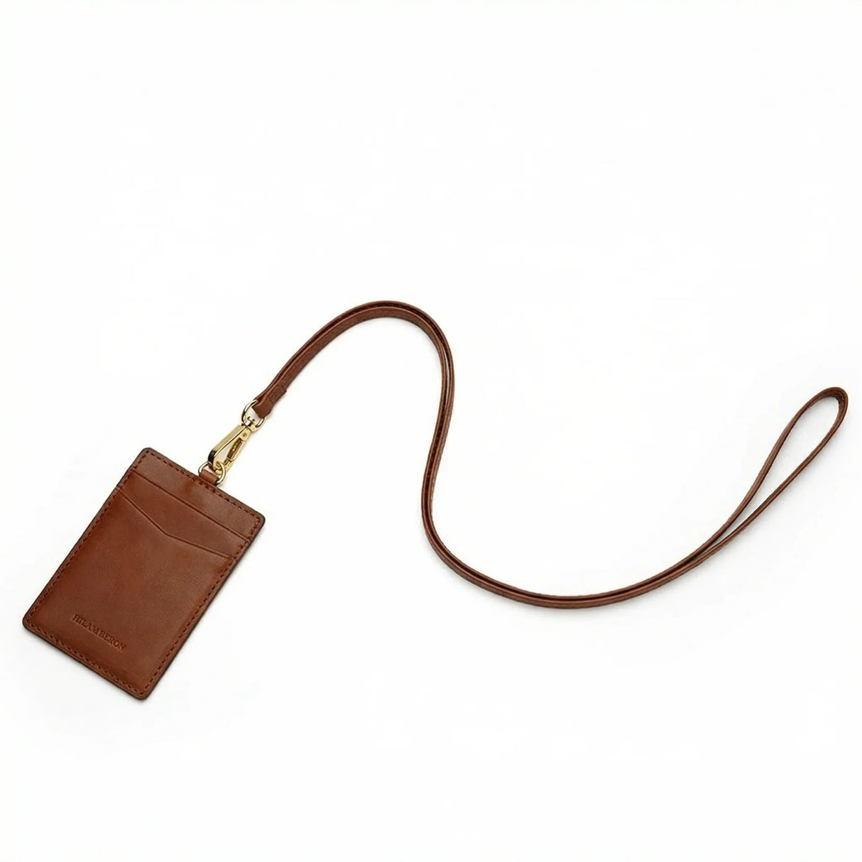Brown leather cardholder with a strap on a white background