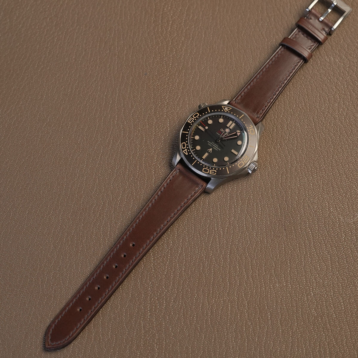 Complete brown Horween Chromexcel watch strap mounted on luxury titanium vintage dive watch