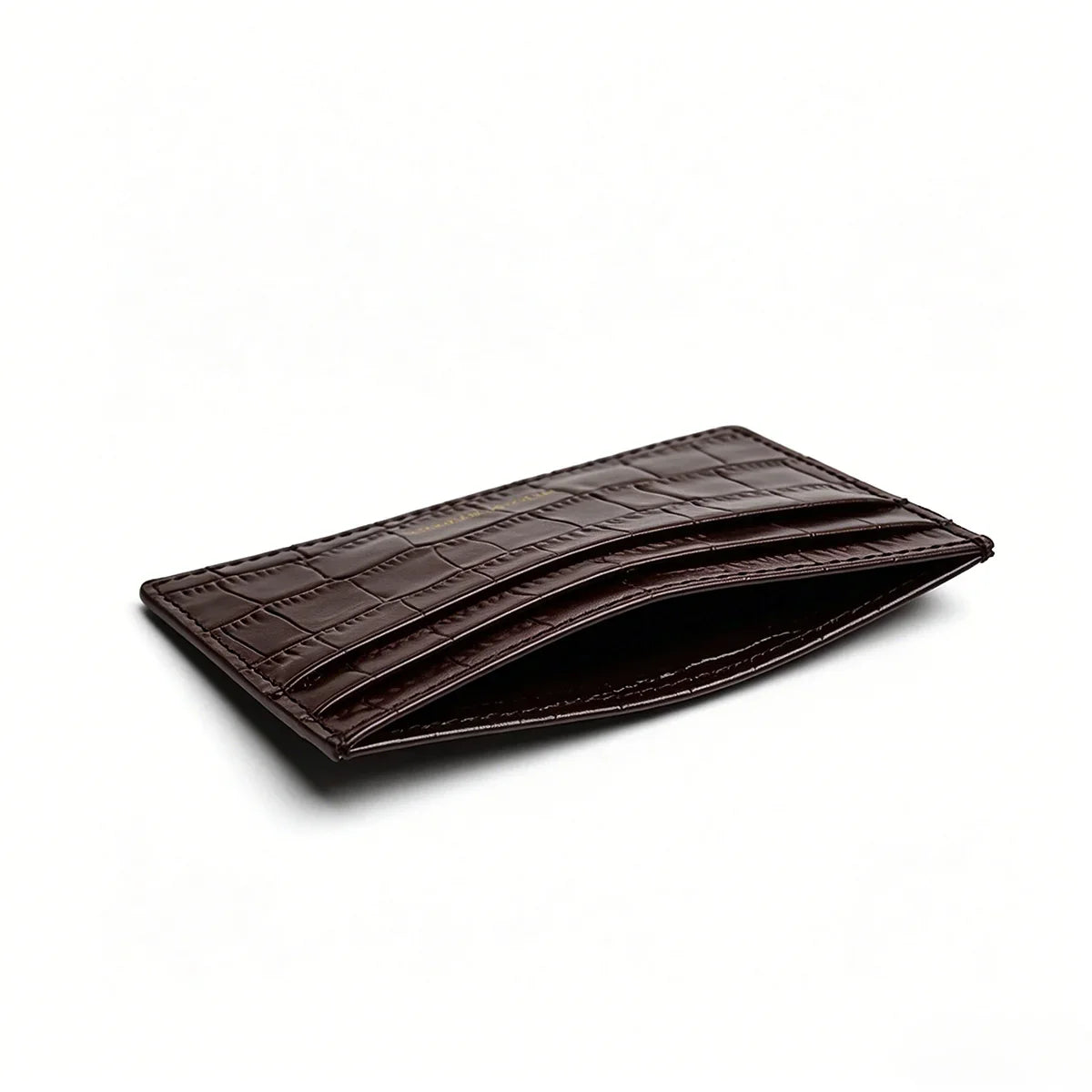 close up of the top pocket for the brown aligator card holder