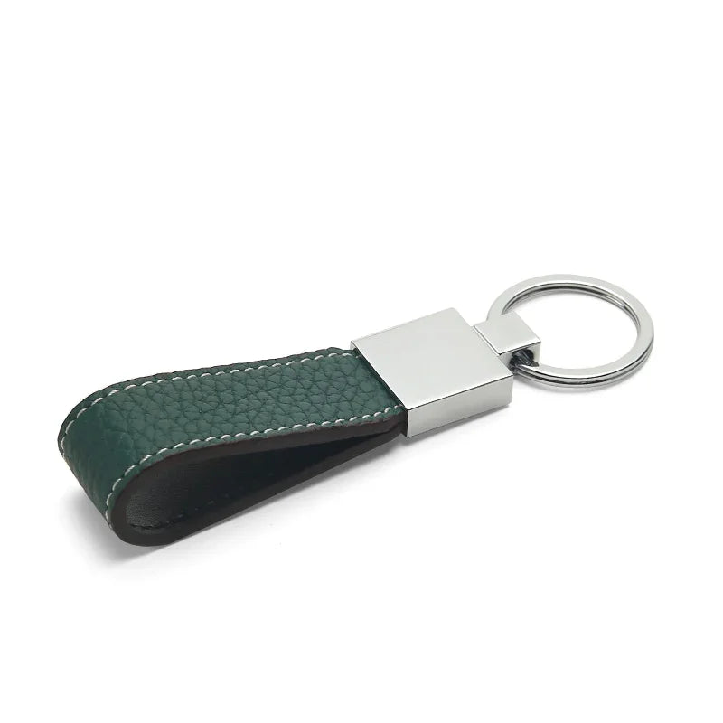 Detail of hand-painted edges on a handcrafted leather key FOB.