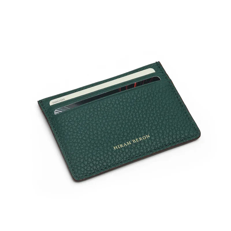 Green pebble leather card sleeve with card slots on a white background