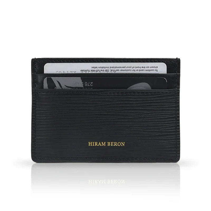 Black EPI leather cardholder with 'Hiram Beron' branding on a white background