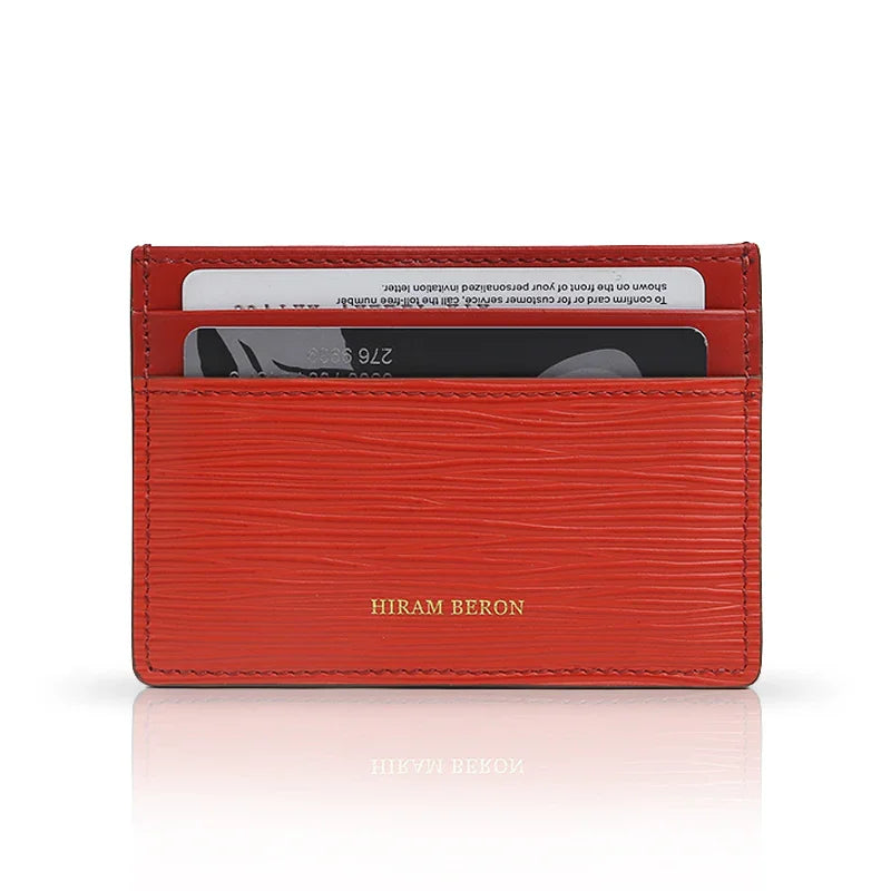 red EPI leather card holder with brand name"HIRAM BERON" on it