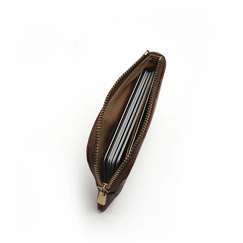 Brown leather wallet with zipper on a white background