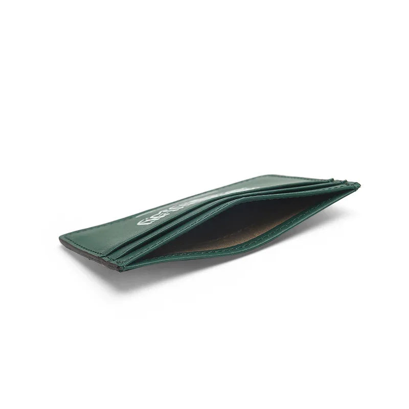 the detail of the top pocket for the green leather card holder